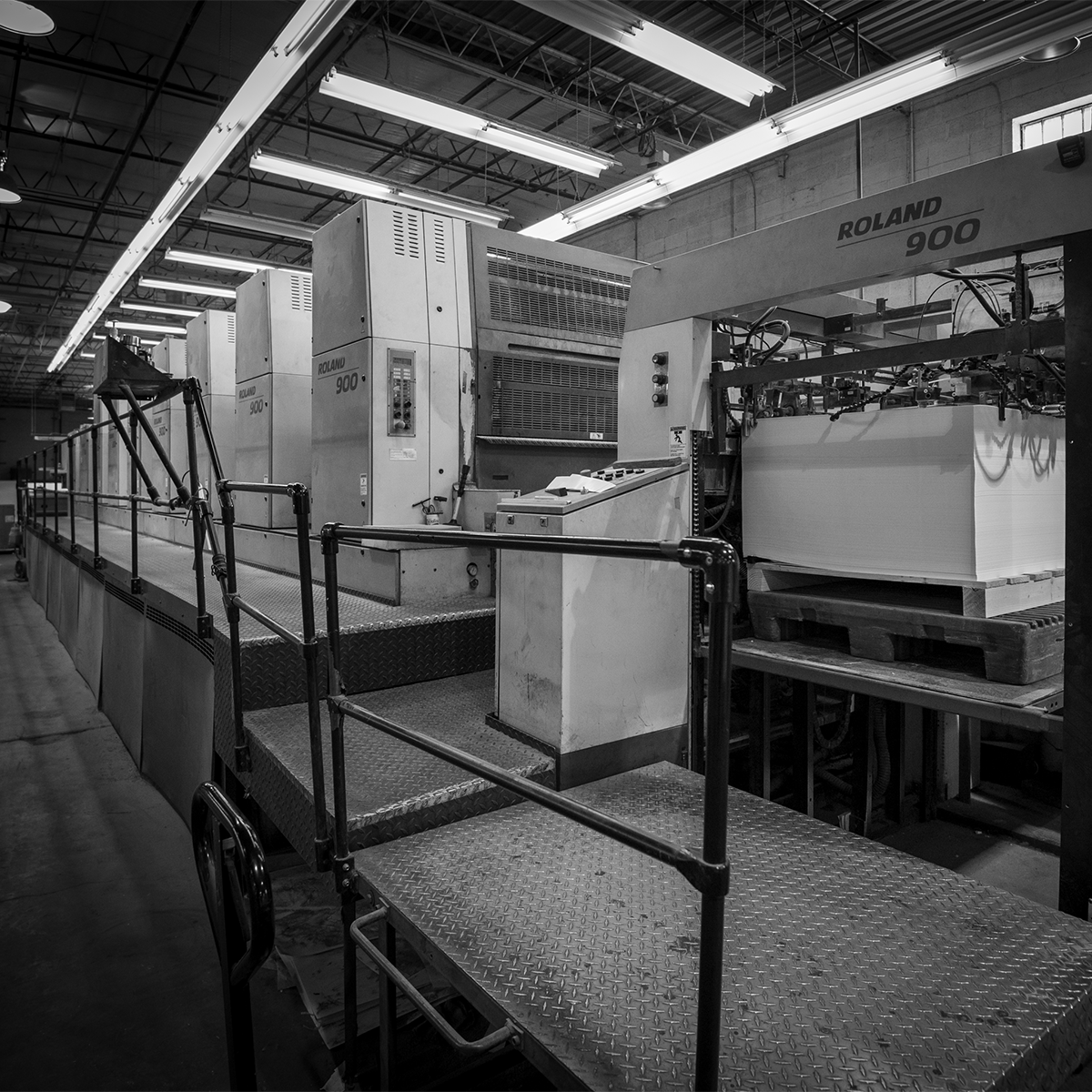 Printing pressroom featuring large litho label and top sheet printing operations
